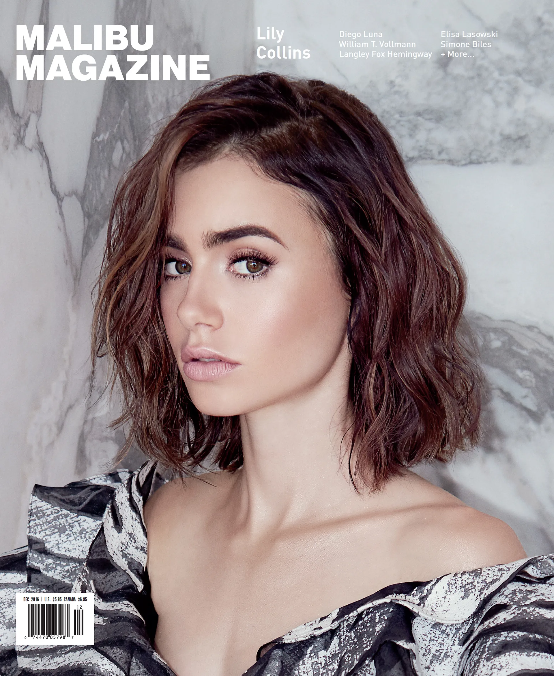 Close-up beauty portrait of Lily Collins for Malibu Magazine, featuring soft wavy dark brown hair, natural makeup, and a black-and-white patterned off-shoulder top against a marble background.