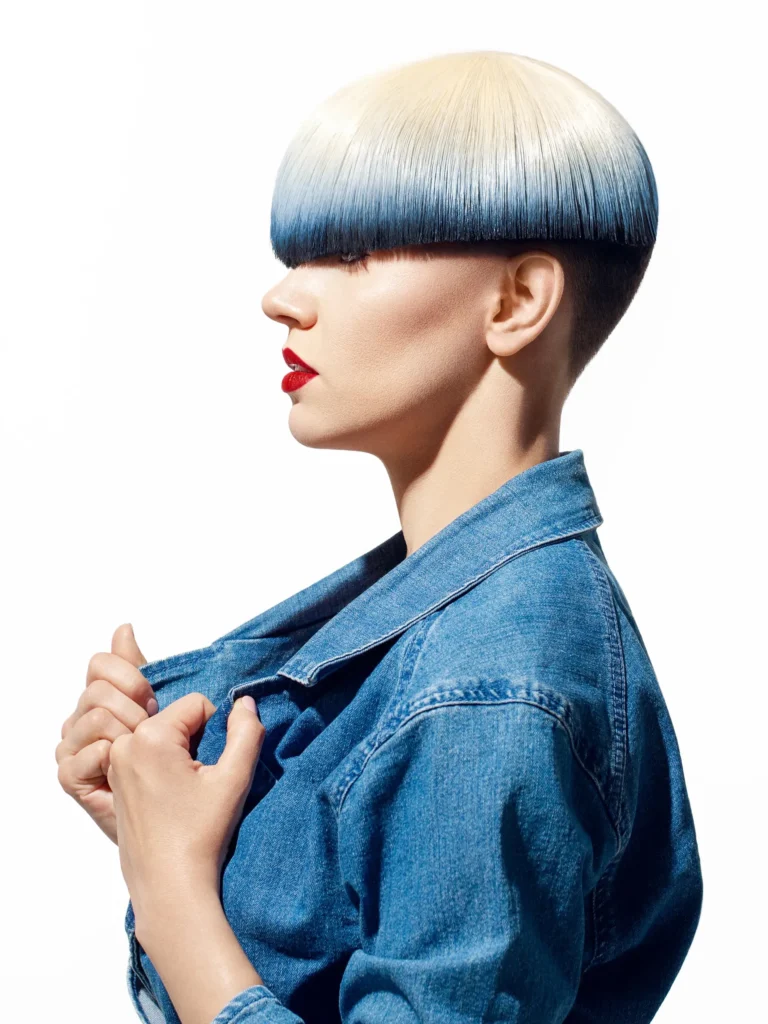 High-End Retouching on profile photograph of a woman with blond hair and blue ends wearing jeans jacket.